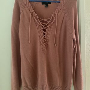 Mauve sweater with strings near chest area